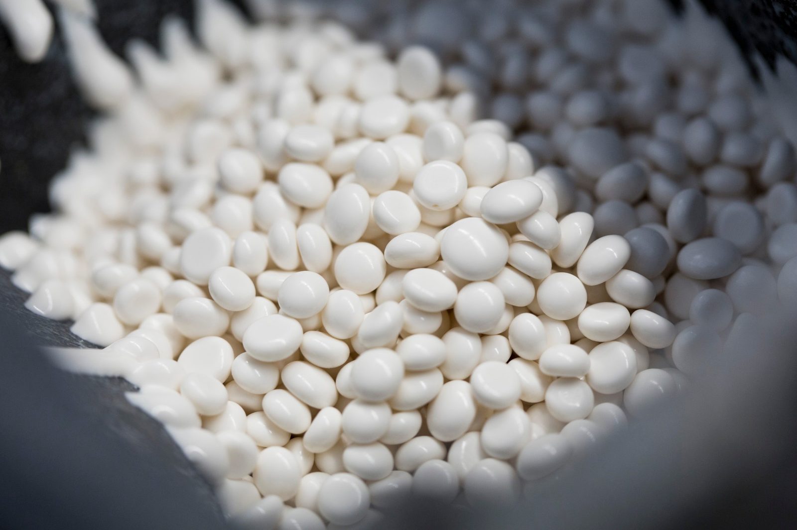 Close-up of white hotmelt adhesive granules