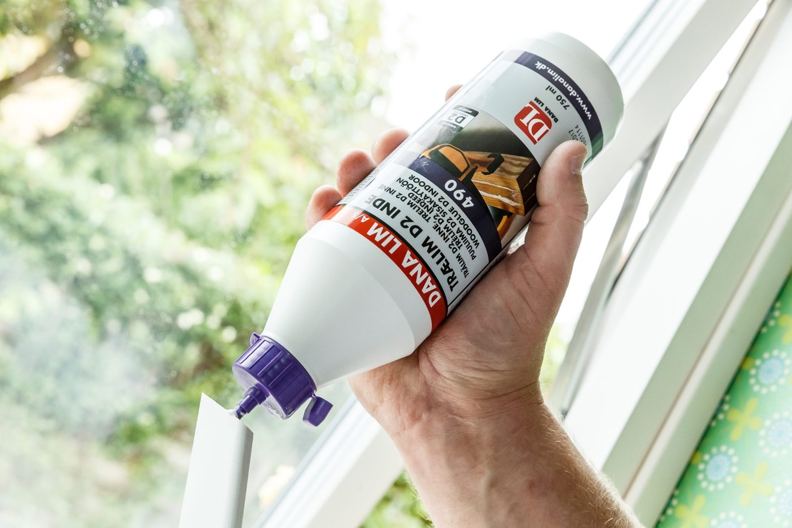 Dana Lim wood glue bottle held by hand