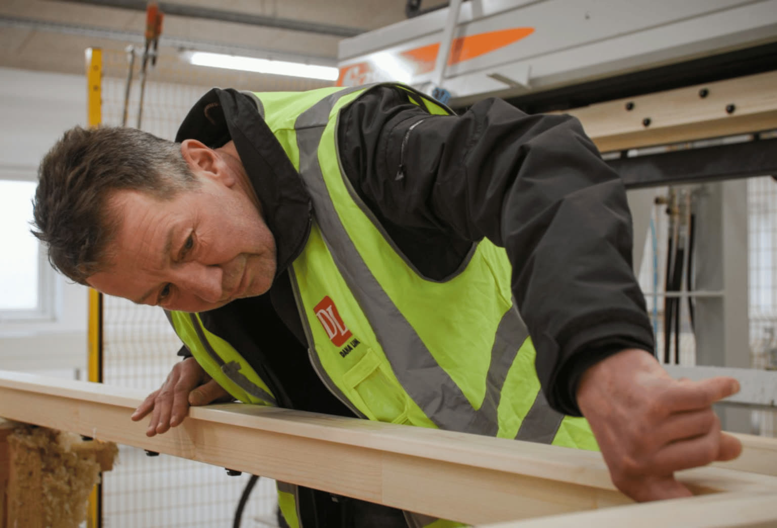 Craftsman working on wooden components for doors, windows, and stairs